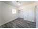 Bedroom with new floors, a window, and a closet with shelving at 26 E Atlantic Ave, Henderson, NV 89015