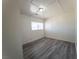Bedroom featuring grey wood floors, light walls, and a window for natural light at 26 E Atlantic Ave, Henderson, NV 89015
