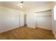 Bedroom showcasing wood floors, a closet, and a connected room at 26 E Atlantic Ave, Henderson, NV 89015