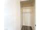 Walk-in closet with built-in shelving, and grey wood flooring at 26 E Atlantic Ave, Henderson, NV 89015