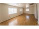 Bright, large living room with hardwood flooring, white walls and natural light at 26 E Atlantic Ave, Henderson, NV 89015