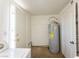 Utility area with water heater, washer, dryer hookups and access to outside at 26 E Atlantic Ave, Henderson, NV 89015
