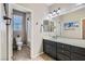 This spacious bathroom features an enclosed toilet, shower and bath, and single sink at 262 Inflection St, Henderson, NV 89011