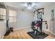 This bedroom is currently being used as an exercise room and includes a ceiling fan and a large window at 262 Inflection St, Henderson, NV 89011