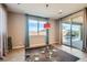 Cozy dining area with large windows and a sliding glass door providing abundant natural light and a view of the pool at 262 Inflection St, Henderson, NV 89011