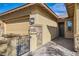 Inviting entrance with a private gate, brick walkway, and stone accents around the doorway at 262 Inflection St, Henderson, NV 89011