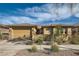 Charming single-story home with a well-manicured lawn, desert landscaping, and an attached two-car garage at 262 Inflection St, Henderson, NV 89011