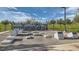 Outdoor fitness area with equipment, stepping stones, and workout instruction boards on a sunny day at 262 Inflection St, Henderson, NV 89011