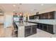 Spacious kitchen featuring a large island with seating, stainless steel appliances, and ample cabinet space at 262 Inflection St, Henderson, NV 89011