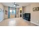 Comfortable living room with a large window, neutral paint, and tile flooring, offering a relaxing space at 262 Inflection St, Henderson, NV 89011