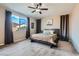 Comfortable main bedroom with a ceiling fan, large windows, and neutral tones for a calming atmosphere at 262 Inflection St, Henderson, NV 89011