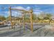 Community playground featuring a wooden climbing structure, and surrounding trees and landscaping at 262 Inflection St, Henderson, NV 89011