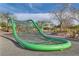 Community playground featuring a green climbing structure, in a park-like setting at 262 Inflection St, Henderson, NV 89011