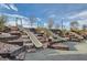 Community playground featuring fun slides built on rocks and wood beams in a beautifully landscaped park at 262 Inflection St, Henderson, NV 89011