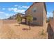 Expansive backyard with decorative rock, young trees, and a view of neighboring homes at 2767 Lindsey Springs St, Las Vegas, NV 89142
