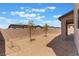 Backyard featuring decorative rock landscaping, trees, and a brick perimeter wall at 2767 Lindsey Springs St, Las Vegas, NV 89142