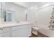 This bathroom is bright and has a single sink vanity and shower-tub combination at 2767 Lindsey Springs St, Las Vegas, NV 89142