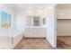 A bright bathroom with double sink vanity, separate shower, and tub has access to a walk-in closet at 2767 Lindsey Springs St, Las Vegas, NV 89142