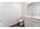 Powder room with a vanity, toilet, and neutral color scheme on the lower level at 2767 Lindsey Springs St, Las Vegas, NV 89142