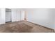 Bedroom featuring neutral carpet, closet with sliding doors, and white trim at 2767 Lindsey Springs St, Las Vegas, NV 89142