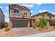 Charming two-story home featuring a paved driveway, neutral stucco exterior, and an attached two-car garage at 2767 Lindsey Springs St, Las Vegas, NV 89142