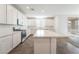 Stylish kitchen boasts stainless steel appliances, white cabinets, and large countertops, perfect for entertaining at 2767 Lindsey Springs St, Las Vegas, NV 89142