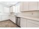 Modern kitchen featuring stainless steel appliances, white cabinetry, quartz countertops, and tile floors at 2767 Lindsey Springs St, Las Vegas, NV 89142