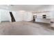 Spacious open-concept layout with neutral carpeting, and integrated kitchen with stainless steel appliances, ideal for entertaining at 2767 Lindsey Springs St, Las Vegas, NV 89142