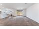 Bright living space featuring an open floor plan to kitchen and sliding glass door to the backyard at 2767 Lindsey Springs St, Las Vegas, NV 89142