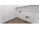 Utility room with durable tile flooring, and wall shelves above utility connections at 2767 Lindsey Springs St, Las Vegas, NV 89142