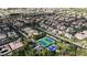Aerial view of a community featuring a tennis court, basketball court and residential homes at 2826 Barrow Downs St, Las Vegas, NV 89135