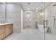 Bright bathroom features a freestanding tub and separate glass shower near a walk in closet at 2826 Barrow Downs St, Las Vegas, NV 89135