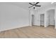 Bright bedroom with wood-look floors, closet, and an ensuite bathroom at 2826 Barrow Downs St, Las Vegas, NV 89135