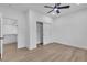 Spacious bedroom with ceiling fan, closet, and doorway to an additional dressing area at 2826 Barrow Downs St, Las Vegas, NV 89135