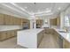Spacious kitchen featuring a large island, stainless steel appliances, and modern cabinetry at 2826 Barrow Downs St, Las Vegas, NV 89135