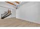 Bright living room showcasing elegant staircase, modern flooring, chandelier, and high ceilings at 2826 Barrow Downs St, Las Vegas, NV 89135