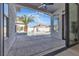 Covered patio with ceiling fan, stylish concrete flooring, and views of the landscaped backyard at 2826 Barrow Downs St, Las Vegas, NV 89135