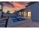 Backyard with pool, lounge area, and manicured landscaping create a serene outdoor oasis at 2826 Barrow Downs St, Las Vegas, NV 89135