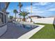 A private pool and patio area is surrounded by lush landscaping at 2826 Barrow Downs St, Las Vegas, NV 89135