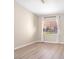 Neutral bedroom with a ceiling fan, light wood floor, and sunny window at 2851 S Valley View Blvd # 1195, Las Vegas, NV 89102