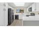 Modern kitchen with white cabinets, sleek countertops, and black appliances for a stylish and functional space at 2851 S Valley View Blvd # 1195, Las Vegas, NV 89102