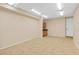 Spacious basement area with tiled floors, bright lighting, and built in cabinets at 3010 Hammerwood Dr, Las Vegas, NV 89135