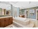 Spacious bathroom with a large tub, double vanity, and elegant finishes at 3010 Hammerwood Dr, Las Vegas, NV 89135