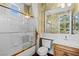 Well-lit bathroom featuring a shower with glass doors, vanity, and toilet at 3010 Hammerwood Dr, Las Vegas, NV 89135