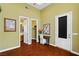 Bedroom with hardwood flooring, a ceiling fan, a walk-in closet, and an attached bathroom at 3010 Hammerwood Dr, Las Vegas, NV 89135
