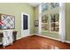 Bright bedroom with natural light, hardwood floors, and white curtains at 3010 Hammerwood Dr, Las Vegas, NV 89135