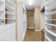 Walk-in closet with custom shelving and ample storage space at 3010 Hammerwood Dr, Las Vegas, NV 89135