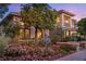 Elegant home featuring a desert landscape, stone accents and a balcony at 3010 Hammerwood Dr, Las Vegas, NV 89135