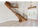 Elegant foyer featuring a grand staircase, travertine flooring and a double door entry at 3010 Hammerwood Dr, Las Vegas, NV 89135
