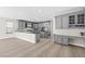 Spacious kitchen with gray cabinetry, granite countertops, stainless steel appliances, and a large center island at 3010 Hammerwood Dr, Las Vegas, NV 89135